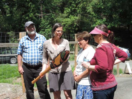 Northwest Straits Foundation Board Member Ken Carrasco and Interim Executive Director Joan Drinkwin present  Dianna Down and Sydney Exton with commemorative paddle - Photo by Nancy Way, The Watership Company, West Beach Creek project contractor