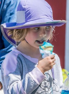 On a hot day in Friday Harbor, a young lady enjoys a stylish blue ice cream cone - Click to enlarge - Aaron Shepard photo