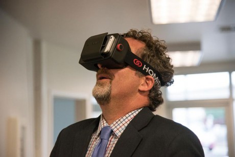 Kevin Ranker takes a ride on a roller coaster with the STEM Center's Virtual Reality goggles - Tim Dustrude photo