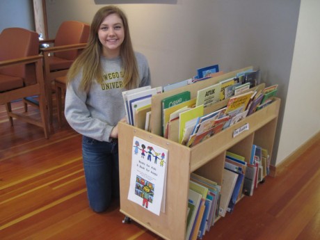 Patricia Deitz and a cart full of books - Contributed photo